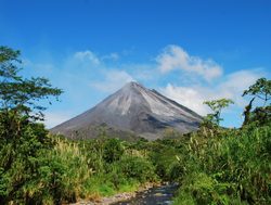 Arenal National Park with blue sky and volcano