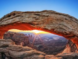 Sunrise through an arch in Canyonlands