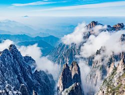 Huangshan National Park peakingn through the clouds