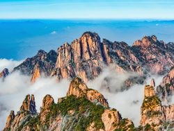 Huangshan National Park rugged mountains with rolling clouds